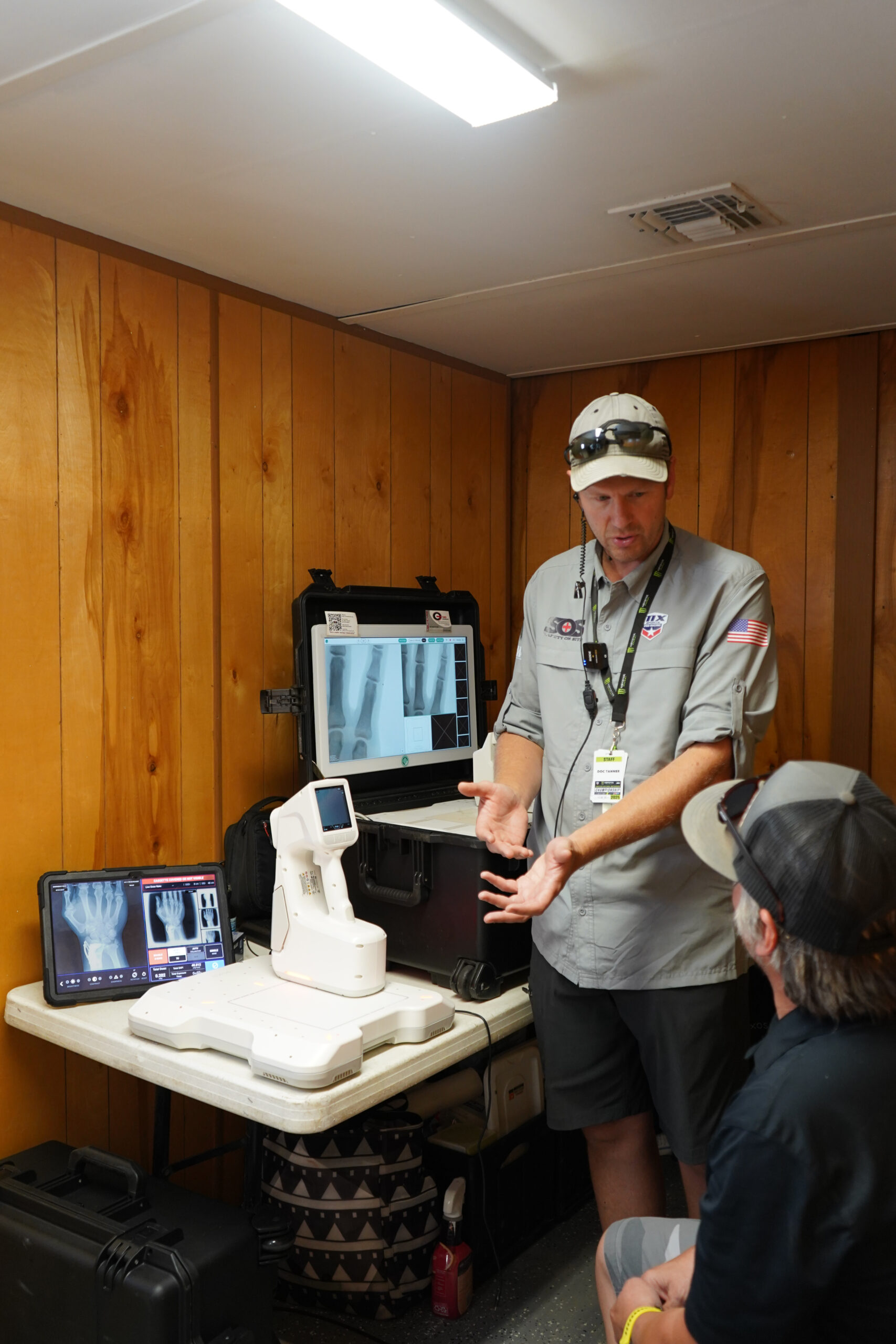 Dr. Tanner explains to his patient what is happening with his wrist.